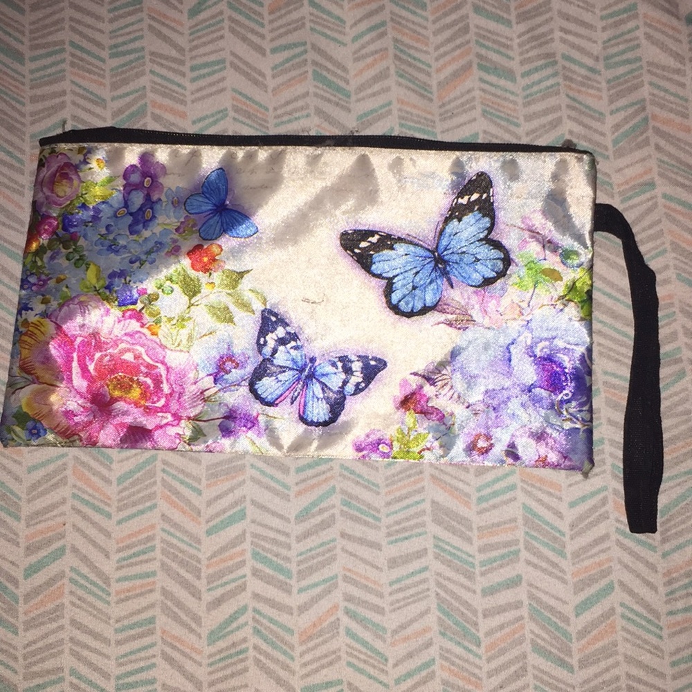 A butterfly and flower wristlet